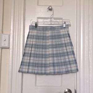 Pleated plaid skirt, pastel blue, light yellow and white accents. Zipper on back